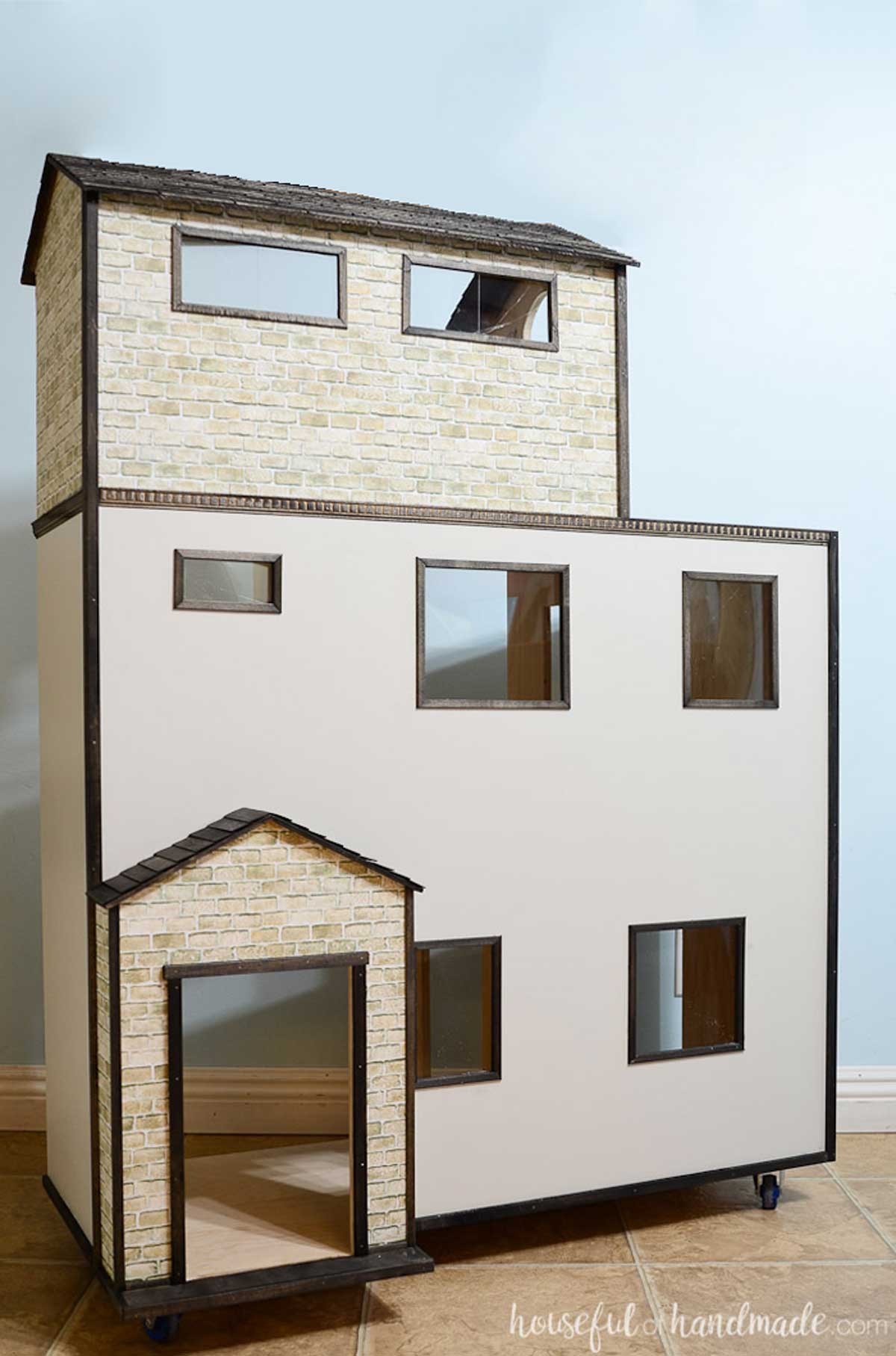 Barbie sized dollhouse made from 1/2" plywood and decorated to look like a cottage.