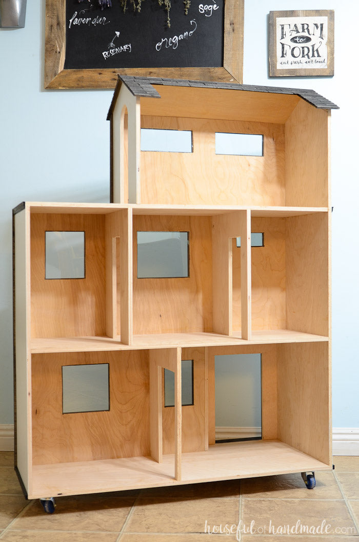 Inside of the DIY dollhouse from the build plans with 6 rooms and a balcony.