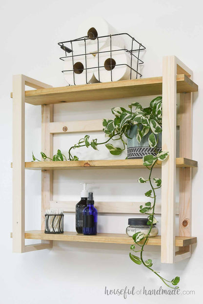 DIY wall shelves with bathroom items stored on them. 