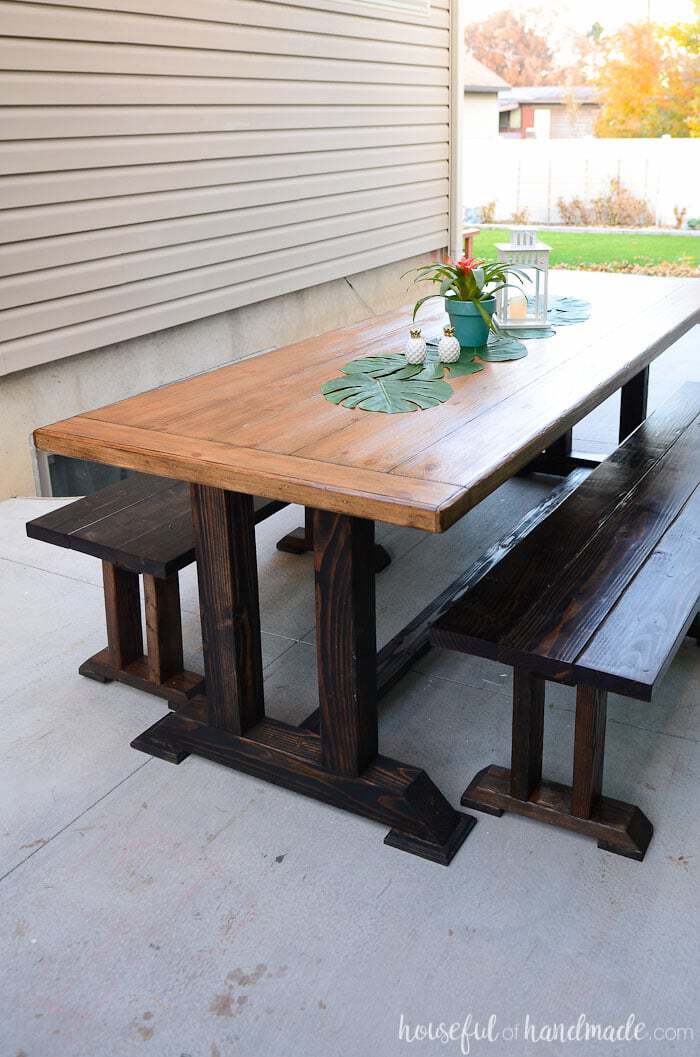 Create the perfect entertaining space with these outdoor dining table plans. A large picnic table with benches is a wonderful way to enjoy dinner outside with your guests. Housefulofhandmade.com