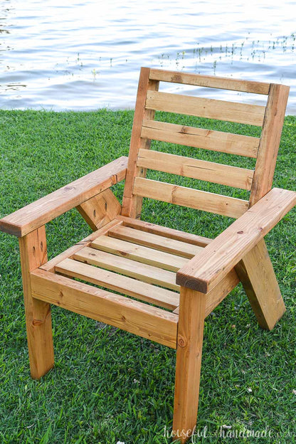 DIY outdoor chair with horizontal seat slats on the grass.